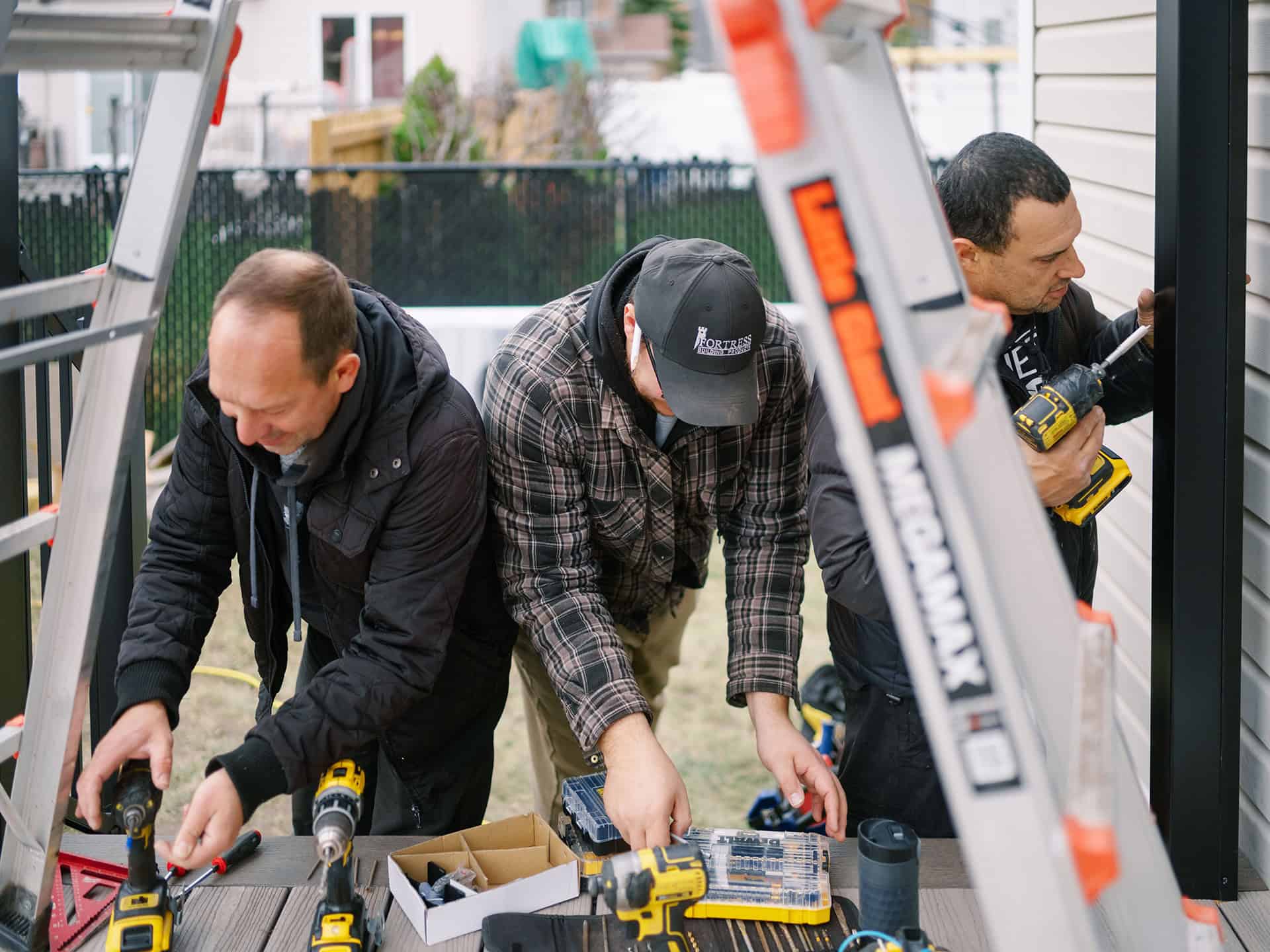 Ottawa Deck Builders team working together on a backyard deck